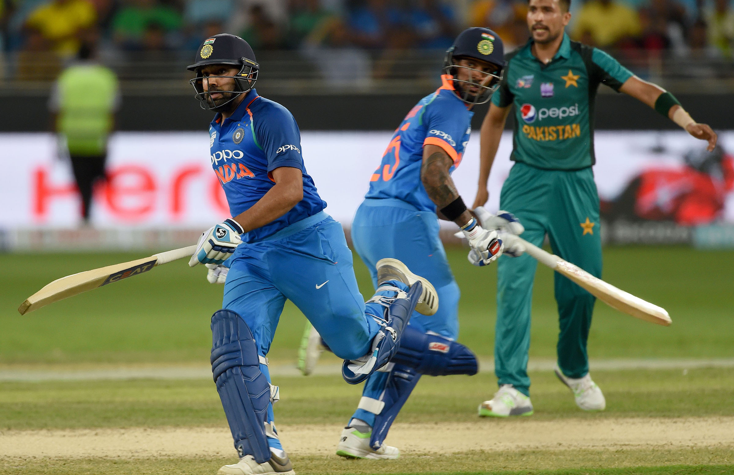 India surge into Cup final after twin tons
