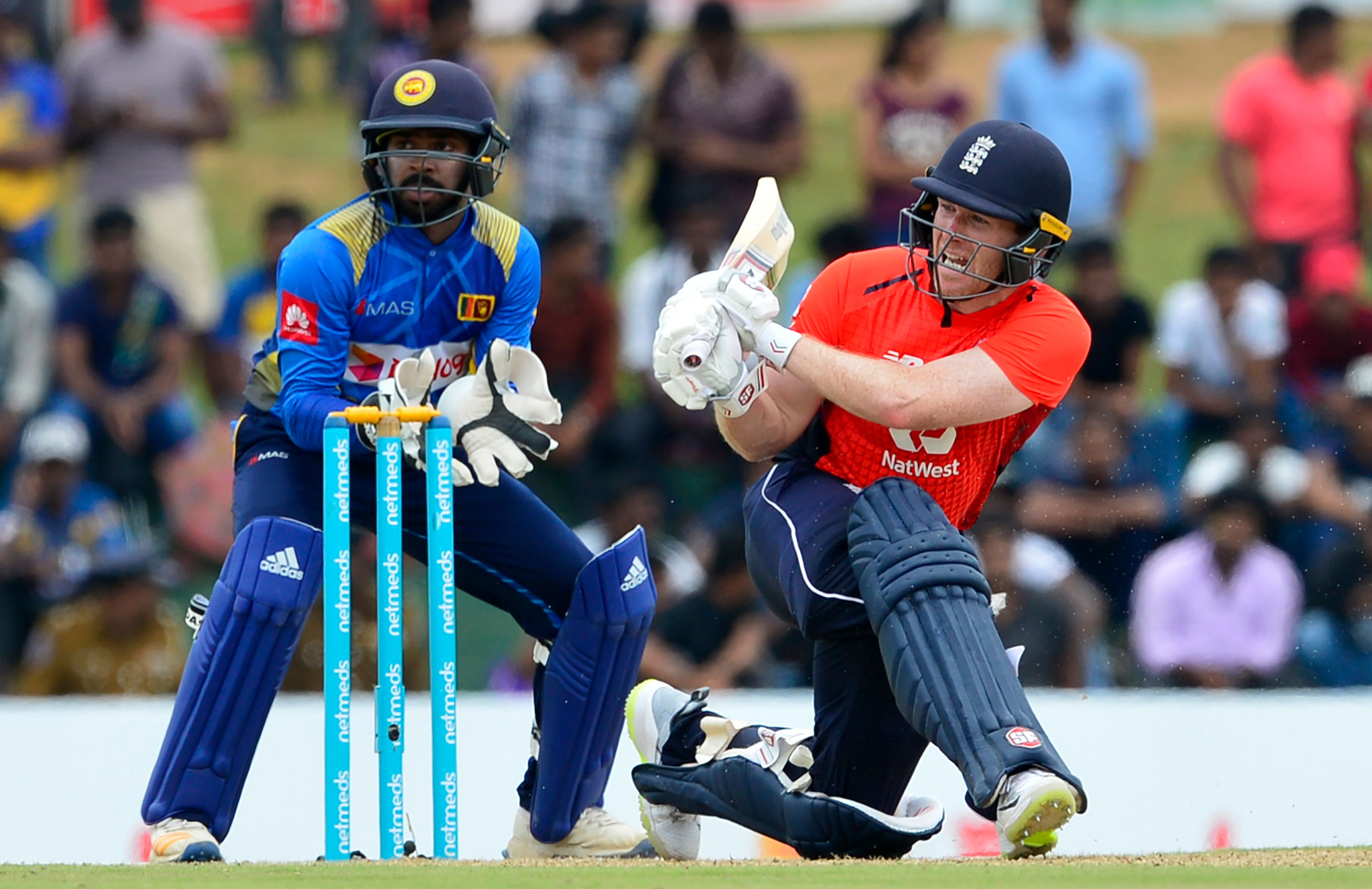 Morgan helps England to rain-affected win