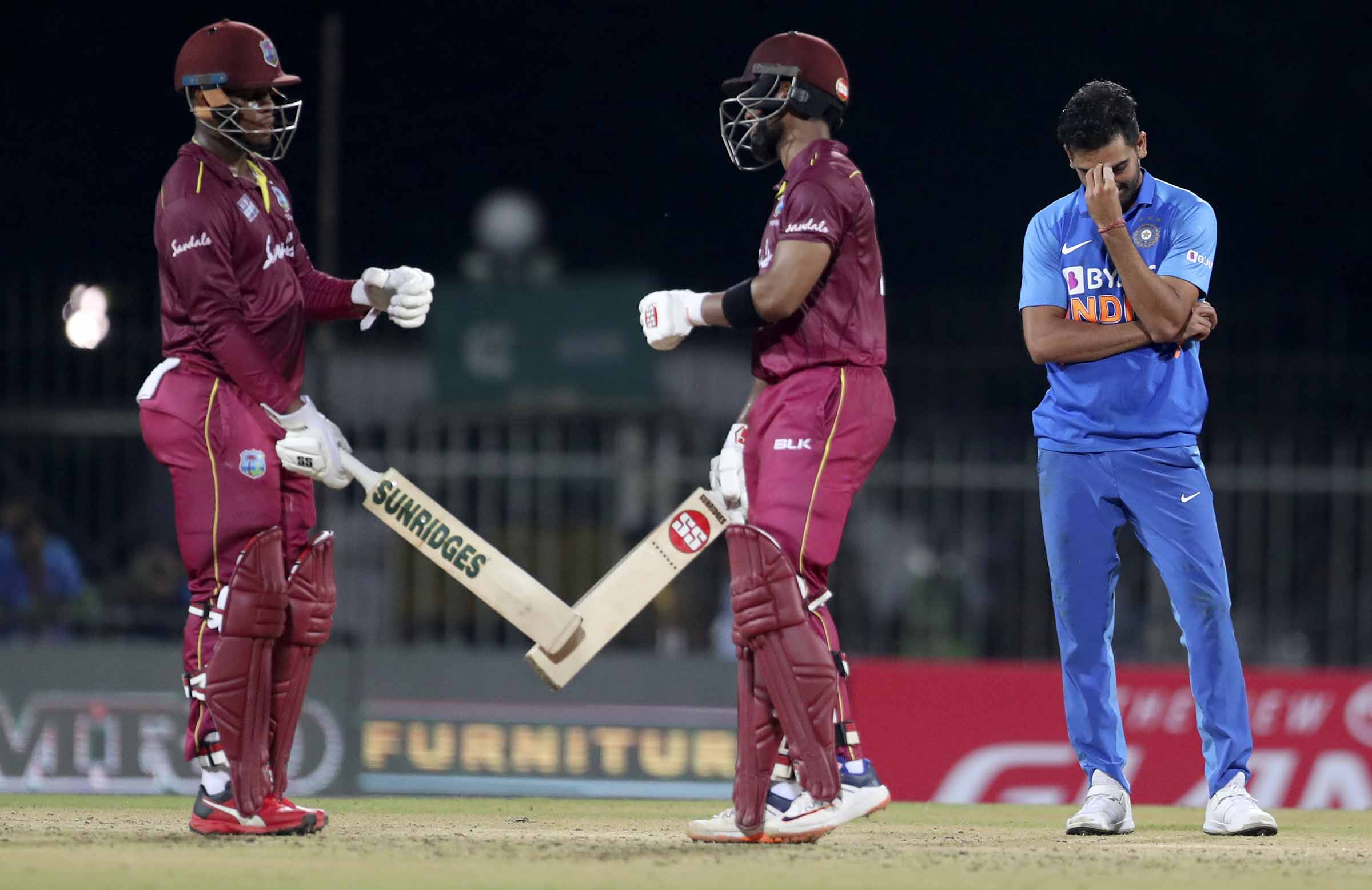 Windies down India courtesy of twin tons